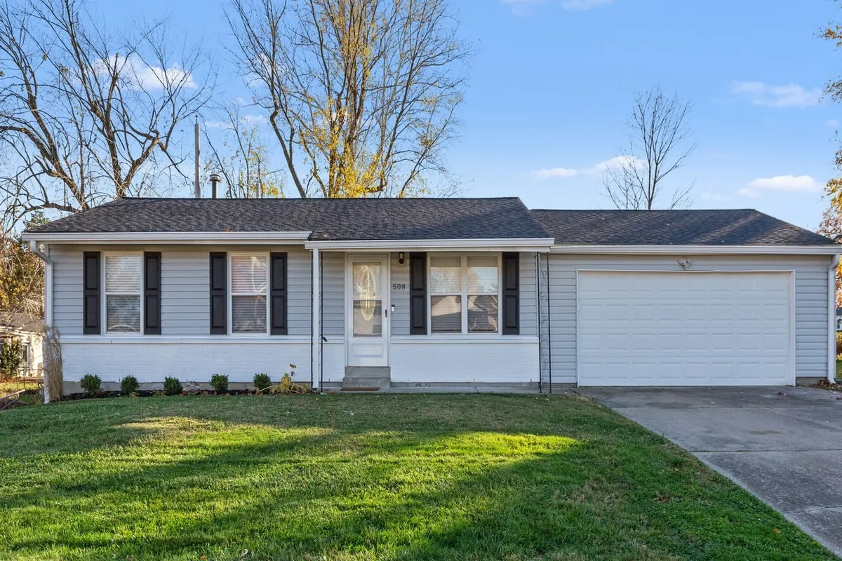 Front exterior of The Secret Sojourn ranch home with two-car garage at 508 Trudy Ln, O'Fallon
